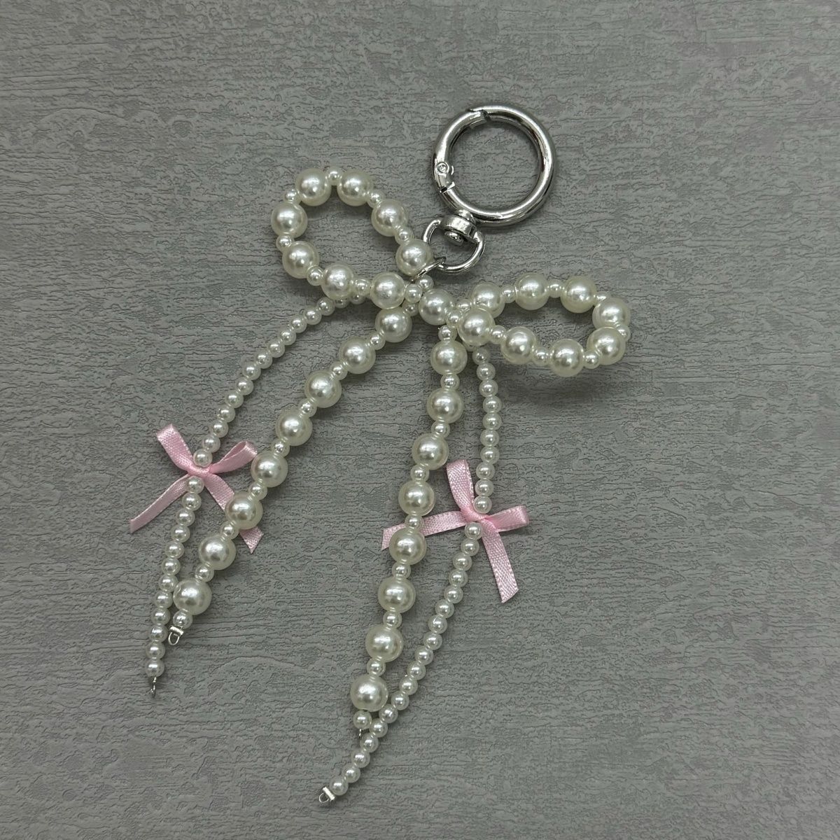 Korean Pearl Bow Phone Charm – Stylish & Feminine