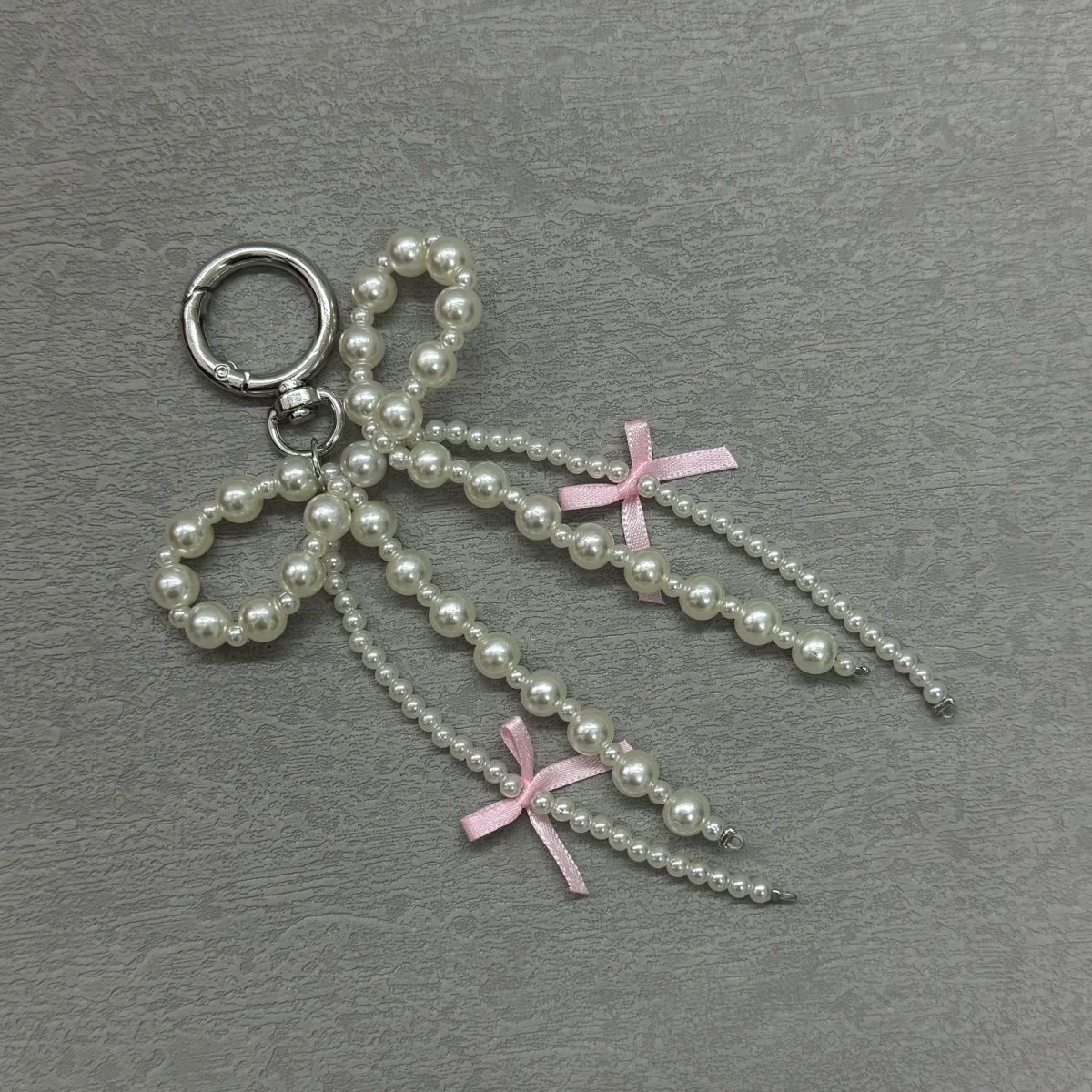 Korean Pearl Bow Phone Charm – Stylish & Feminine