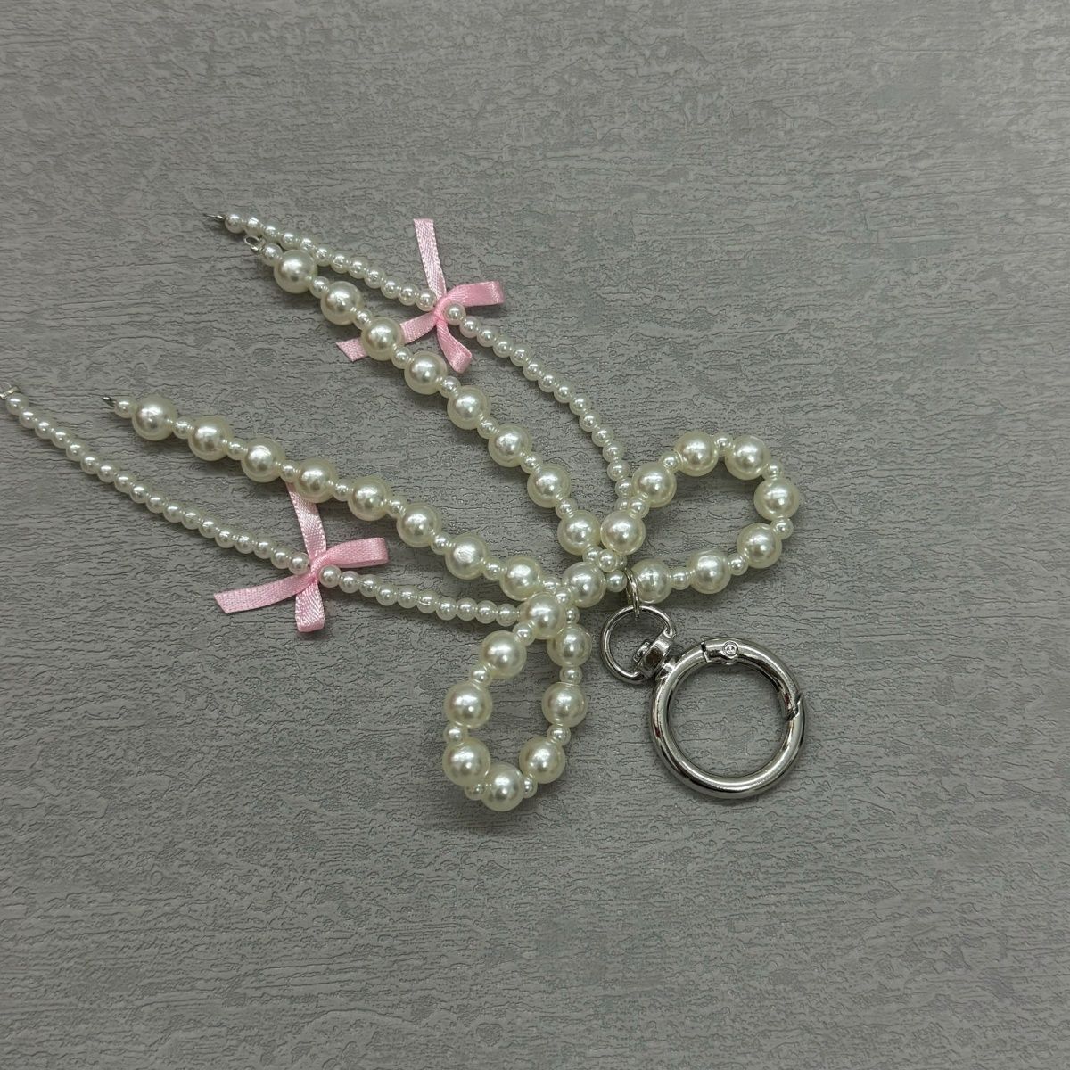 Korean Pearl Bow Phone Charm – Stylish & Feminine